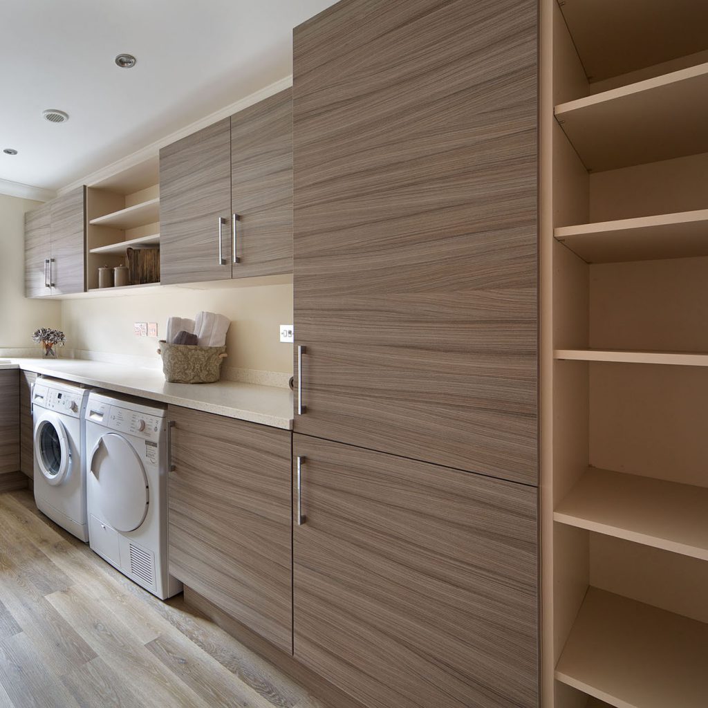 Laundry area with upper and lower storage units